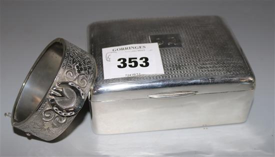 An engine turned silver cigarette box and a silver bracelet